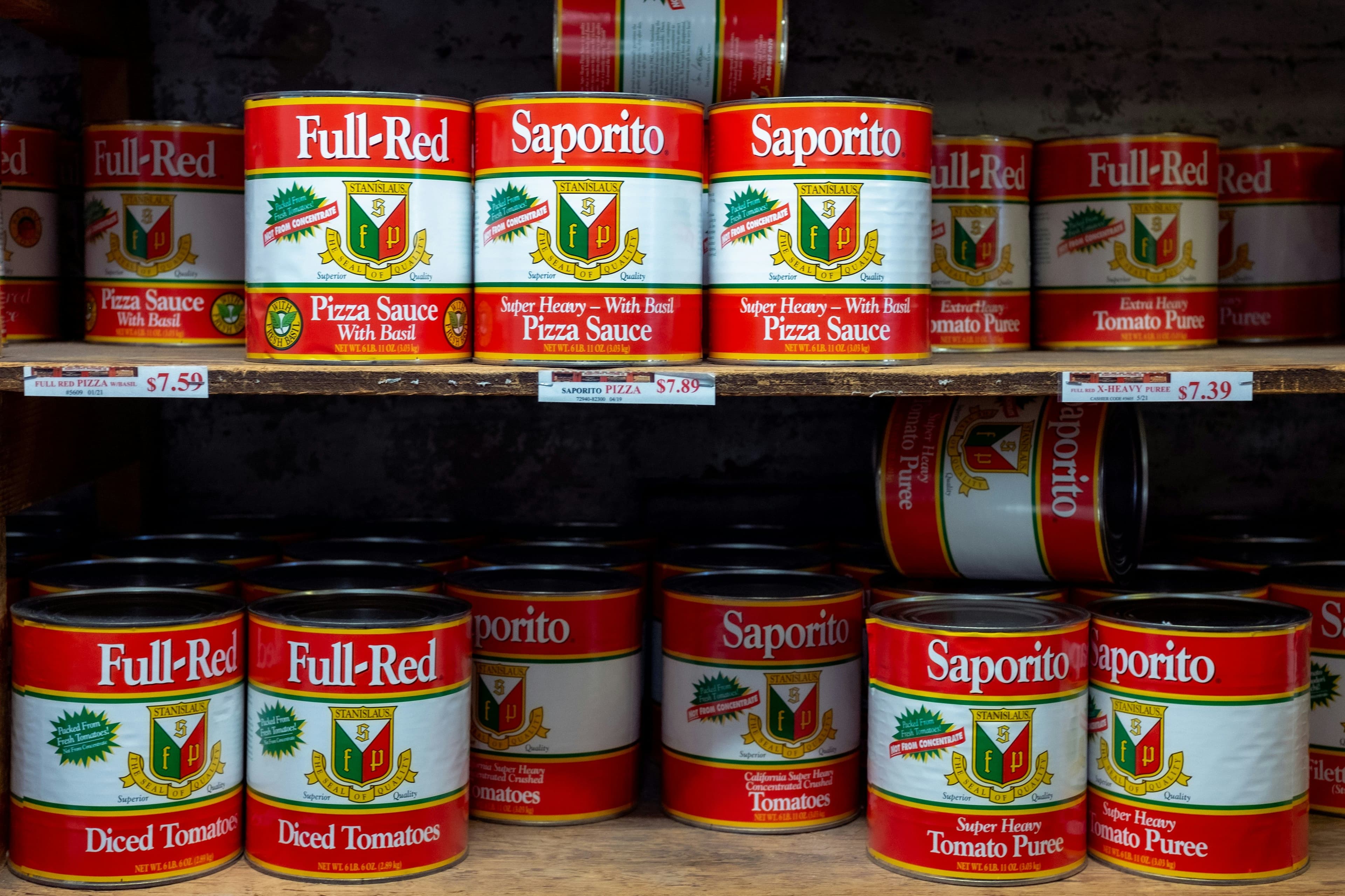 canned tomato products on shelf